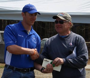 Peter LaBerge awarding match winner Bryan Litz.